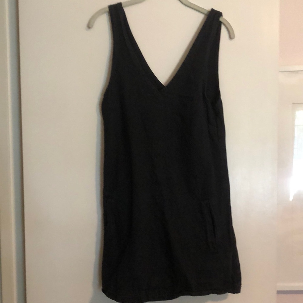 Black denim-style dress. V-neck with pockets. Size 4